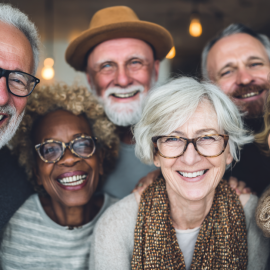 A smiling group of senior friends who like each other