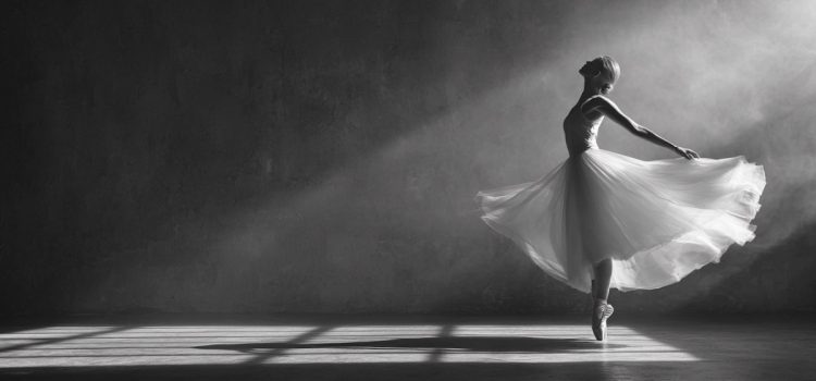 A ballet dancer in a flowing dress balancing on her tiptoes illustrates counterbalance instead of a balanced life