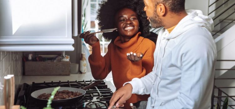 happy couple cooking