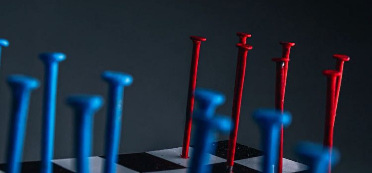 red and blue nails on chessboard