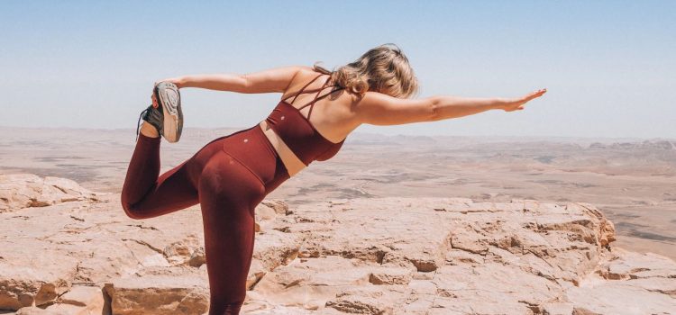 woman doing yoga in the desert