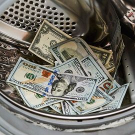 A washing machine full of dollar bills as part of a money laundering scheme.