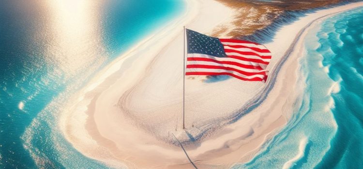A US American flag on a sandy beach
