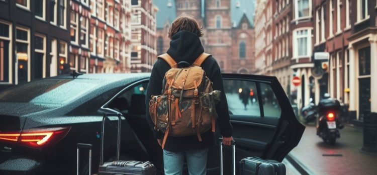 A man with lots of luggage standing in a city outside a car