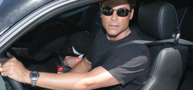 Rob Lowe in a car