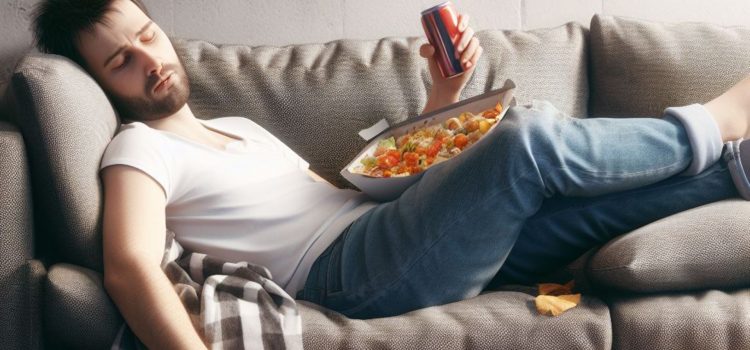 A guy lying to himself about his health as he sits on the couch with junk food and a soda can in his hand.