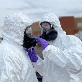 Two members of the Ohio National Guard wearing hazmat suits after the East Palestine train derailment