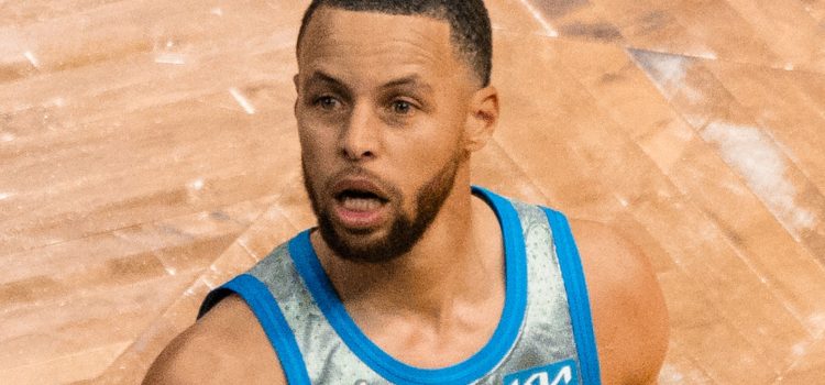 Smartless: Stephen Curry Reveals His Secret to Success Stephen Curry with his mouth open on the basketball court.