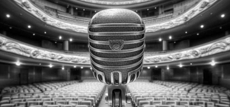 A black and white image of a vintage microphone in an auditorium, representing the life of a comedian.
