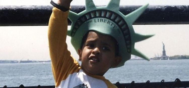 Vivek Ramaswamy as a child wearing a Statue of Liberty hat.