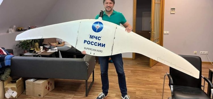 Serhiy Prytula holding a Russian drone captured by Ukrainian forces
