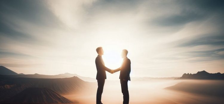 Two men shaking hands outside with the sun behind them in a win-win negotiation.