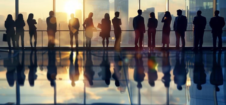 Silhouettes of business leaders standing in front of a window, representing a platform business model.