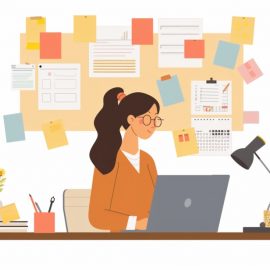 A woman practicing business task management by working on a computer with sticky notes behind her.