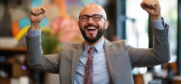 What Is a Brand Personality? The Key to a Recognizable Company A happy manager in his office using a brand personality for the company