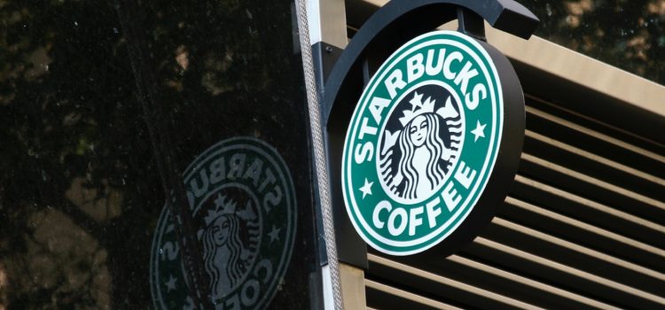 The Starbucks Business Model After 3 Turnaround Strategies A Starbucks sign that represents Starbucks's business model