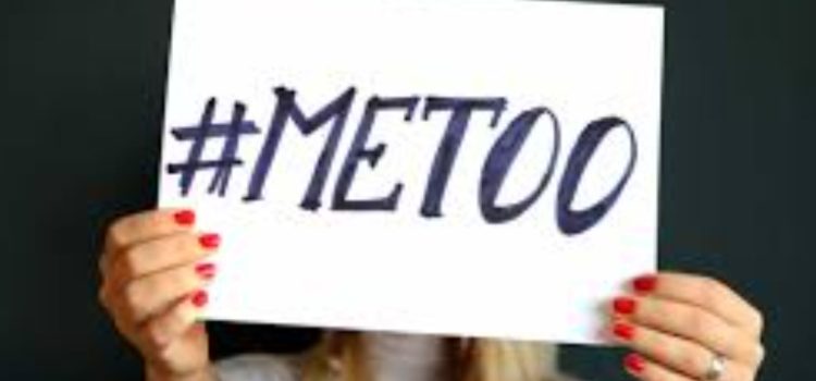 The “Me Too” Movement’s Impact on Tarana Burke & the World A woman holding up a sign that reads "#MeToo," showing the impact of me too movement