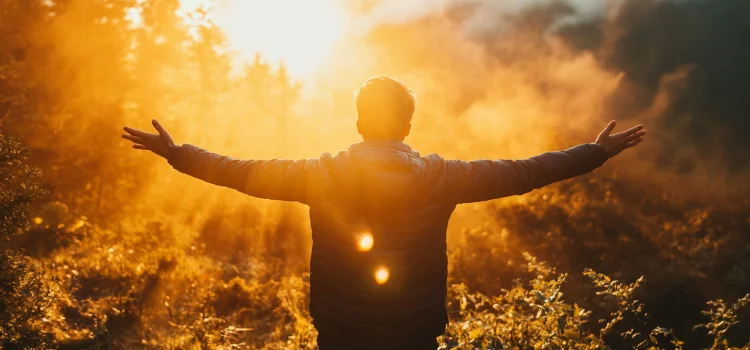 How to Replenish Your Energy: 3 Methods of Preservation A man who knows how to replenish his energy, holding his arms out in front of the sun