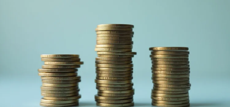 Ray Dalio: Economic Cycles of Debt & Credit Are Natural Three stacks of coins (tall, short, and tall) represent economic cycles