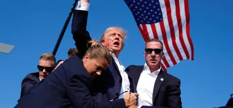 Melania Trump on the Assassination Attempt: A Call for Healing Melania Trump's husband Donald Trump raises his fist after being shot in an assassination attempt in Butler, PA, in July 2024