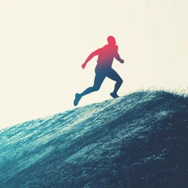 A man running up a hill after he decided to take action in life