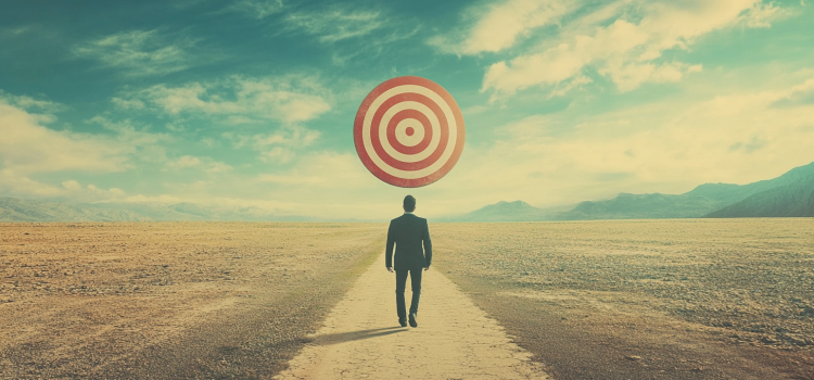 How to Follow Through on Goals: 4 Steps to Succeed A man walking toward a target in the middle of nowhere, trying to follow through on goals