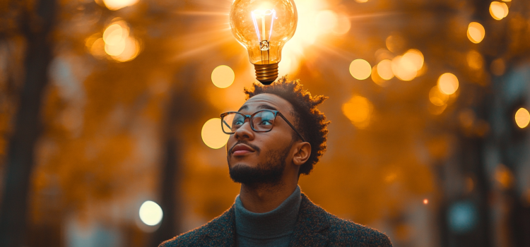 3 Characteristics of Insight Explained (and 3 Myths Debunked) A spectacled man with a lightbulb over his head illustrates the characteristics of insight