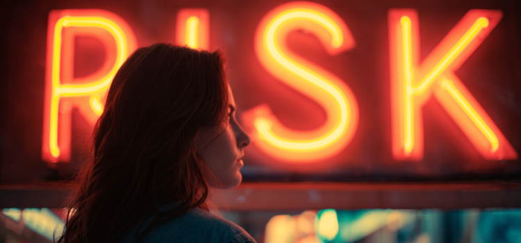 A woman looking at a neon sign that reads "RISK"