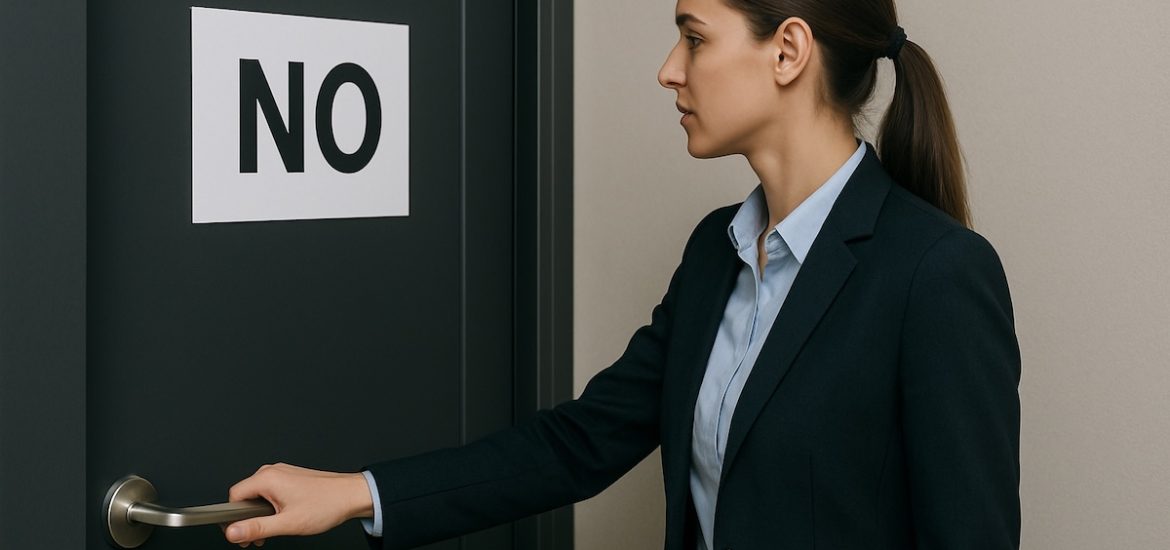 A professional woman with her hand on the handle of a door with a sign that says NO depicts how to handle rejection in sales
