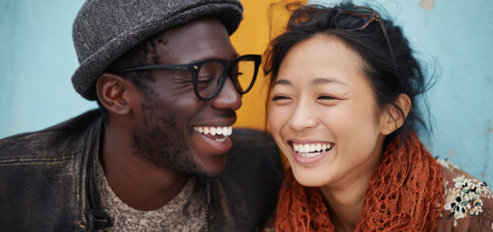 A happy man and woman laughing together as they reconnect