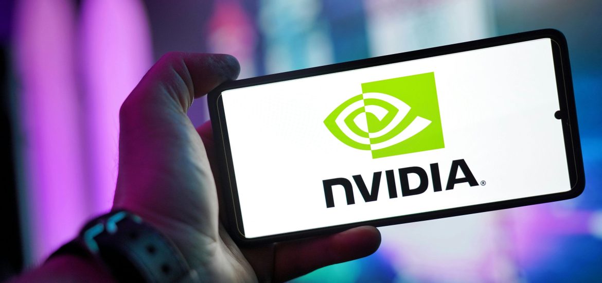 A hand holding a phone screen that has the Nvidia logo