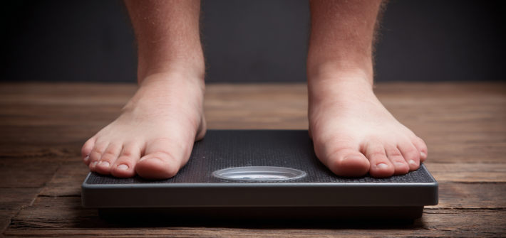 Feet standing on a scale