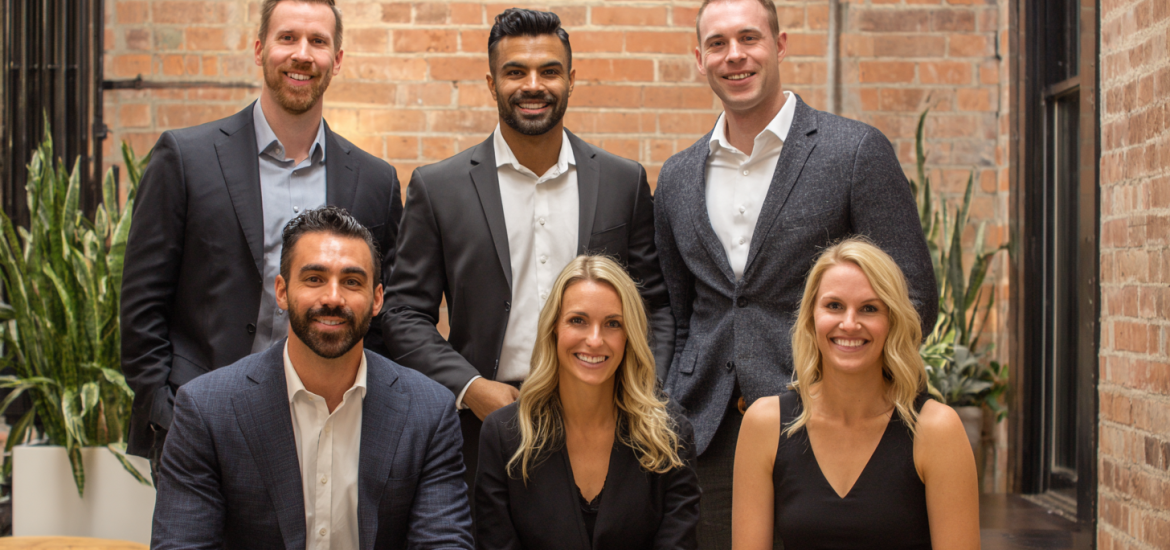 A founding team of a startup posing for a picture