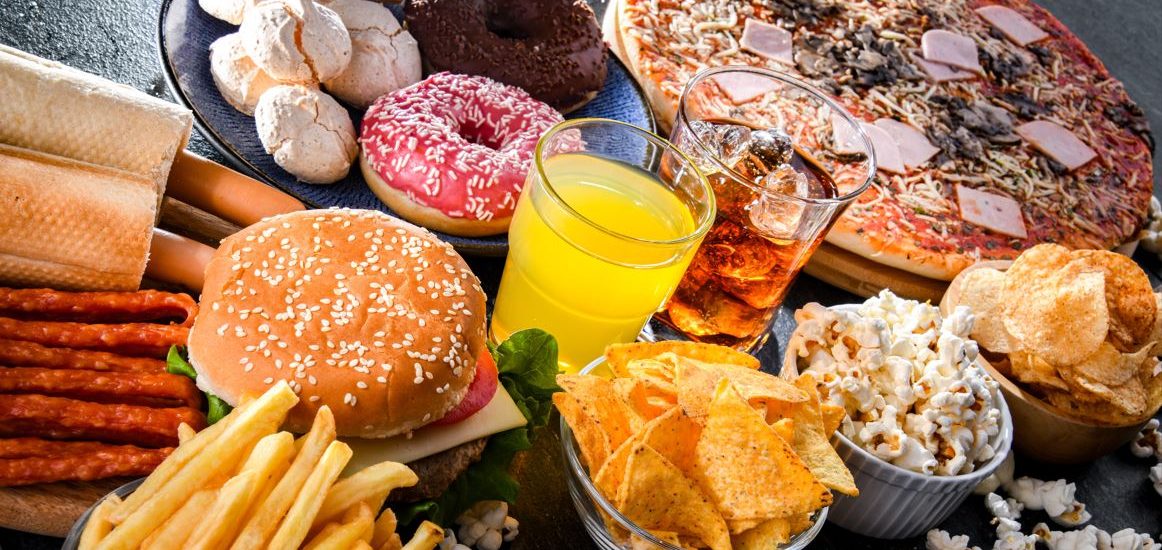 A spread of different types of junk food on a table