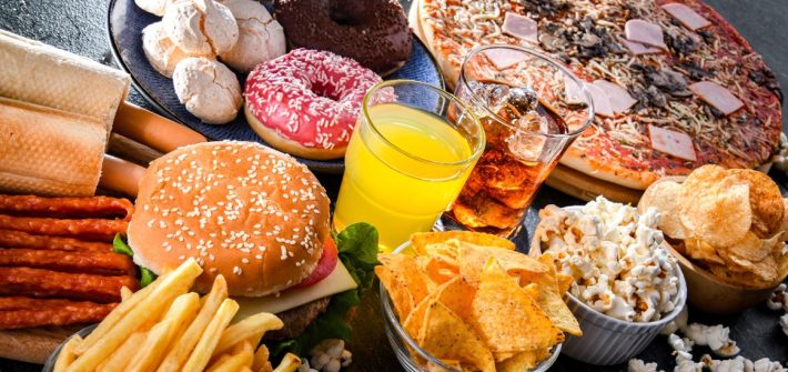 A spread of different types of junk food on a table