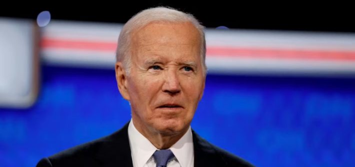 President Joe Biden speaking on stage