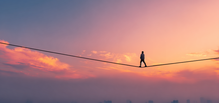 A man walking on a tightrope to take a risk
