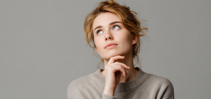 A woman doing a thinking pose, wondering how to learn faster